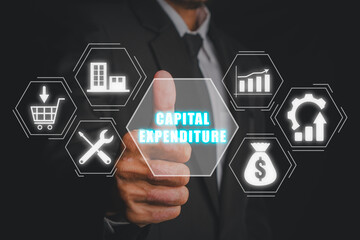Capital expenditure concept, Businessman hand touching capital expenditure icon on virtual screen.