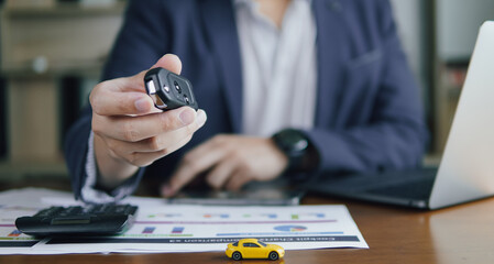 Concept of Finance business Car leasing Car sales business, Business people holding key of car and...