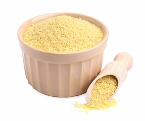 Bowl and scoop with raw couscous on white background