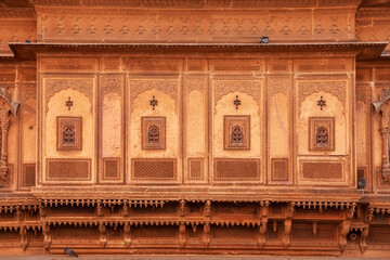 Fototapeta na wymiar Heritage building in Rajasthan, India made of yellow limestone known as the Patwon ki Haveli in Jaisalmer city in India