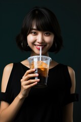 Asian girl woman drinking iced coffee. Vietnamese coffee. Happy. Morning. Cheerfulness.