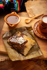 Oaxacan Tamales. Prehispanic dish typical of Mexico and some Latin American countries. Corn dough wrapped in banana leaves. The tamales are steamed.