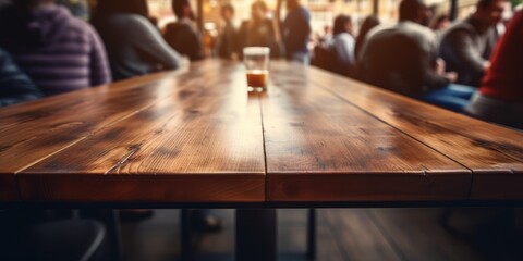 Brown wooden table in coffee shop interior with people meeting in background, suitable for displays or montages. - obrazy, fototapety, plakaty