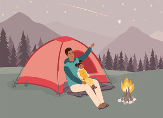 Smiling Black Father And His Little Daughter In Puffer Vest Sitting In Front Of Tent Looking Up At The Shooting Star. Full Length.