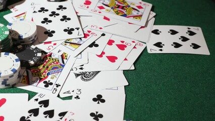 Pokers chips and playing cards on green table background - Powered by Adobe