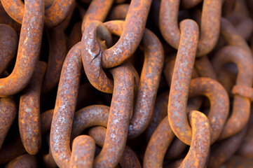 rusty chain on the background of the iron