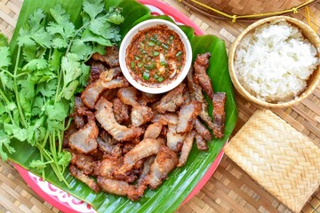 Fried pork with sticky rice and thai style sauce, thai food , thai call Moo tod, top view food table