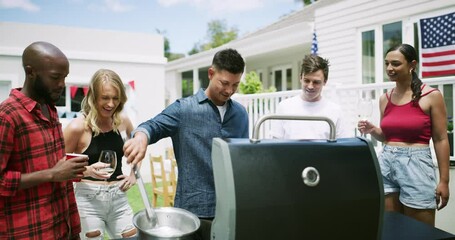 Barbecue, friends and talking at independence day party, grill and celebrating patriotism in outdoors. People, bbq and cooking lunch on grill for national holiday, american flag and food preparation - Powered by Adobe