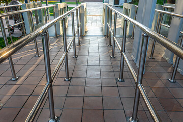 Electronic turnstile. Access system to building. Pass through the passes. Security systems for rooms. Several turnstiles are installed nearby. Check Point. Automatic checkpoint. Building security.