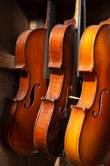 Violins are hanging from ceiling