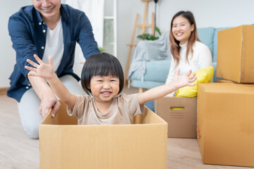 New home for family. activities together during the holidays. Parents and children are having activity on vacant time. weekend, enjoyment, happy family, togetherness, feel good. Move home