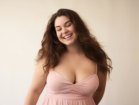 Exuberant Laughter: Curvy Woman in a Soft Pink Dress
