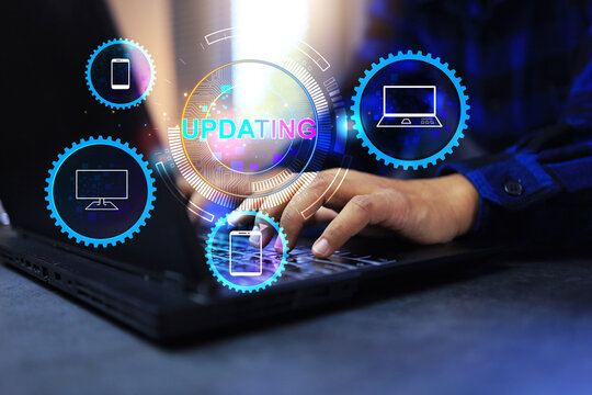 Software update concept with user hand working on laptop computer to updating program feature for enhance efficiency and stronger security on information technology systems