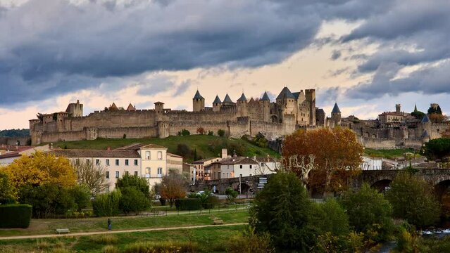 Carcassonne, day to night timelapse showing the famous castle and walled city illimunated at night. France