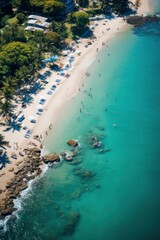 Aerial shot of a tropical beach with waves crashing on sandy shore