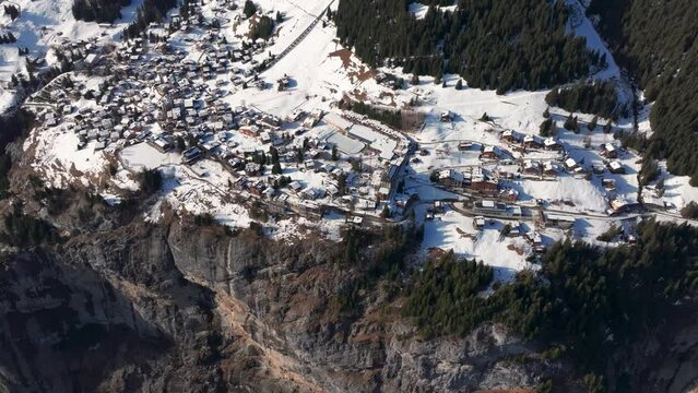 Aerial view of small snow covered Switzerland village Murren