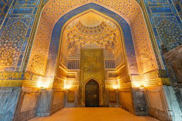 Fototapeta na wymiar interior of the ornate interior of the madrasah, Registan Tilya Kori Madrasah mosaic pattern design background of ceramic tiles in Samarkand city, Uzbekistan