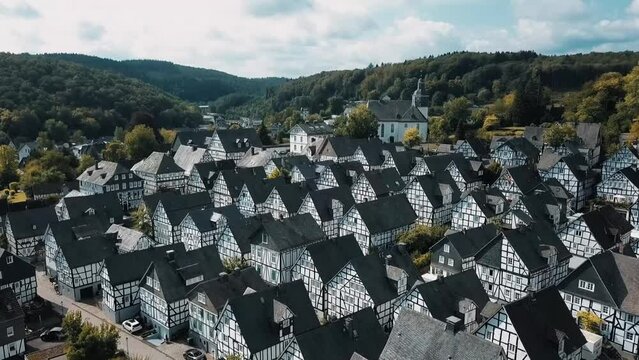 A dolly in drone shot of the cottage houses in Freudenberg