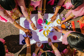 Indian Punjabi pre wedding Maiyan ceremony traditional powder mosaic mandala close up