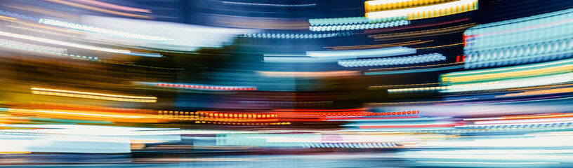 City motion blurred street intersection background at night