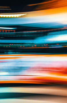 City motion blurred street intersection background at night