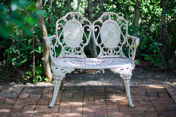Chair in garden amidst nature
