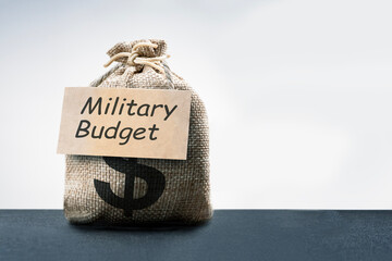 Concept of military budget. Financial support of army. money bag, dollar sign, military budget text...