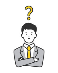 腕組みをして疑問を感じるビジネスパーソン男性