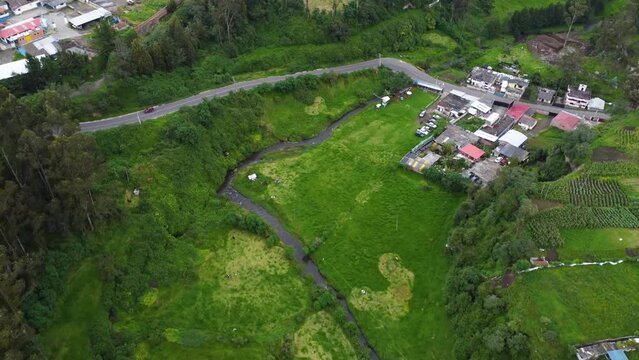 Barrio Guitig San Pedro river meanders along lush green rural farmland AERIAL