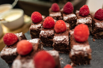Brownie pieces with a raspberry garnish on top