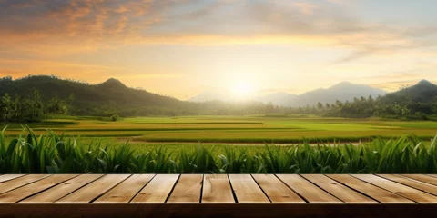 Foto op Canvas Product display, montage, and presentation can utilize a wood table with a sunrise background and rice paddy field. © Sona