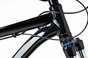 Black bicycle on white background close up