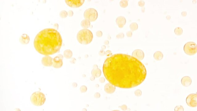 Macro Shot of Various Air Bubbles in Water Rising up on Light White Background. Liquid Cream Gel Transparent Cosmetic Sample Texture With Bubbles. Concept of Clean and Purity. High quality FullHD