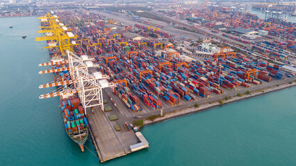 Shipyard industry shipping seafaring vessel at sunries. Cargo container depot port logistics...