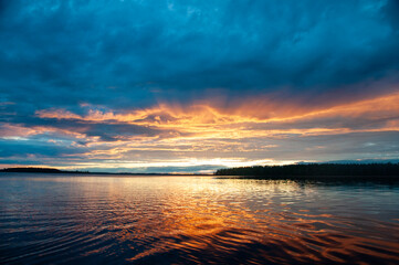 Colorful sunset щк dawn, over the lake, river, sea, blue and red color, calm beauty, nature, evening or morning