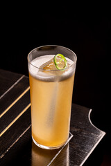 Luxury cocktail on the wooden table on a dark background
