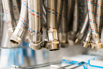 Metal plumbing thin pipes background texture. Lots of gray drain hoses