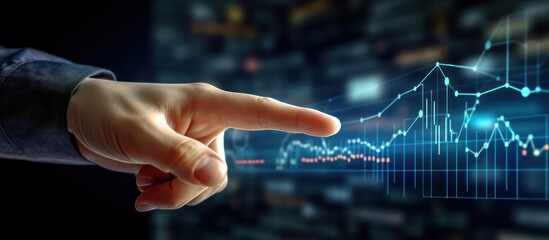 Businessman hand pointing at business growth graph