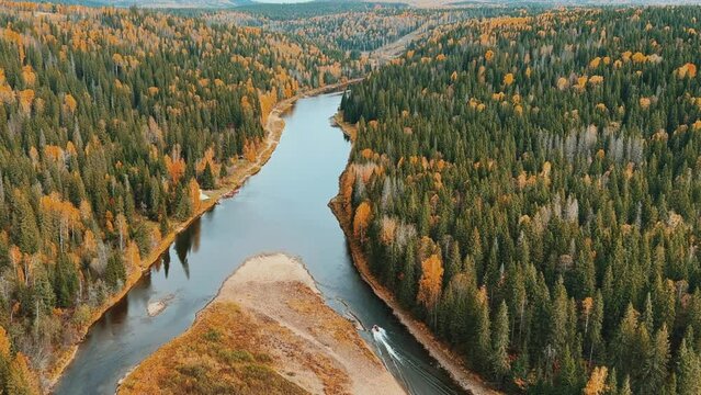 Amazing view of the picturesque Usva River in autumn, near the Usva pillars, flowing through a rocky area in the Perm region, unique landforms, stone pillars. Russia 4K