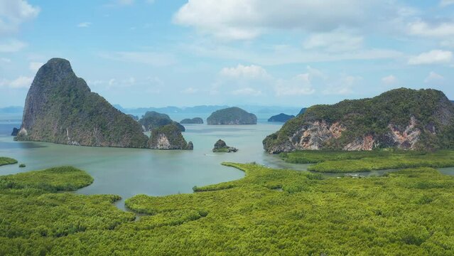 Aerial view of Phang Nga Bay with rocky limestone islands in the sea and there are mangrove forests around. Landscape nature of Samet Nangshe viewpoint.