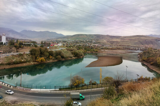 Incredibly captivating view of The Charvak Water Reservoir and the city of charvak in the mountains of The Western Tien Shan in Uzbekistan.