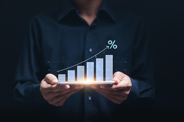 Interest rate and dividend concept, Businessman show  economic growth graph in percentage for investment growth. business financial investment, business growth, income, marketing and profit.