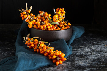 Ripe orange berry, sea buckthorn. Vitamins. Dark background - 712990561