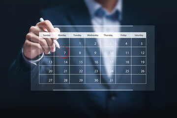 Businessman manage time on virtual screen of calendar for effective work. Highlight appointment reminders and meeting agenda on the calendar. Time management concept. - obrazy, fototapety, plakaty