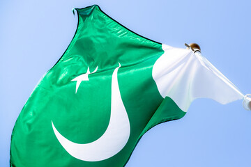 National flag of Pakistan. Pakistan flag against blue sky. Great for news. Waving flag of Pakistan