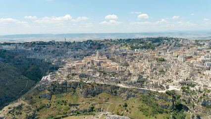 Fototapeta na wymiar Matera, Italy. The old part of the city is carved into the rock and is a UNESCO World Heritage Site. Summer day, Aerial View