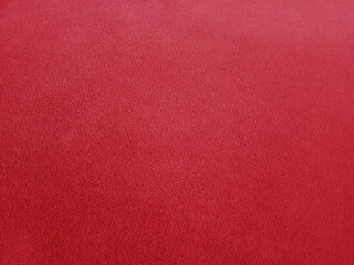 Red velvet fabric background in a luxurious style