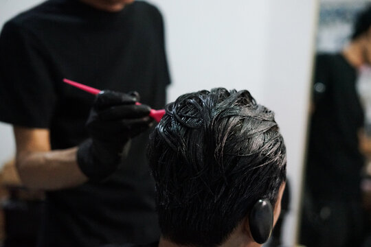 Hair coloring using a brush, in the salon