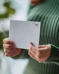 Naklejka premium Close-Up of Grateful Employee Reading a Thank You Note Captured with DSLR Camera