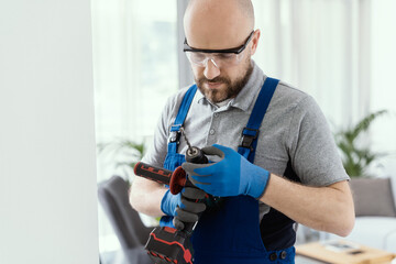 Professional handyman using a drill
